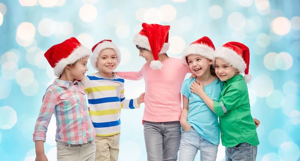 happy little children in christmas santa hats - Foto, Imagen