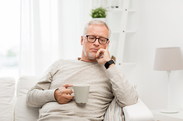 senior man with cup of tea at home - Photo, image