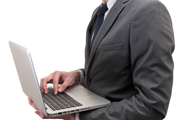 Бізнесмен тримає ноутбук ізольований на білому тлі
. - Фото, зображення