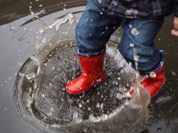 kid in red rubber boots  - 写真・画像