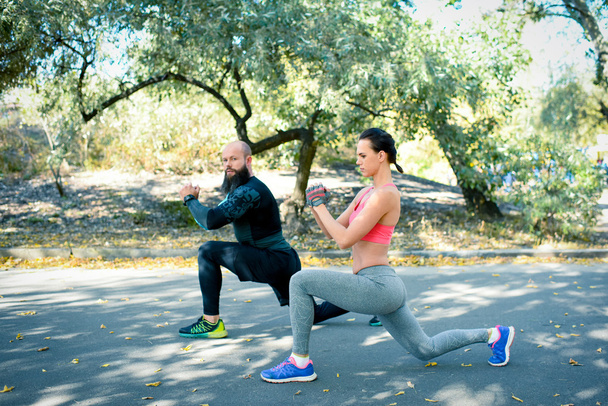 Athletic couple working out together - Photo, Image