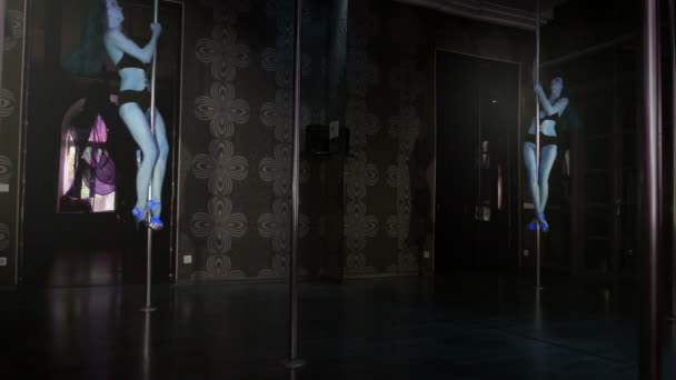 Sexual  stripper  girl in blue shoes training on  pole hall. 4K 3840x2160 - Footage, Video