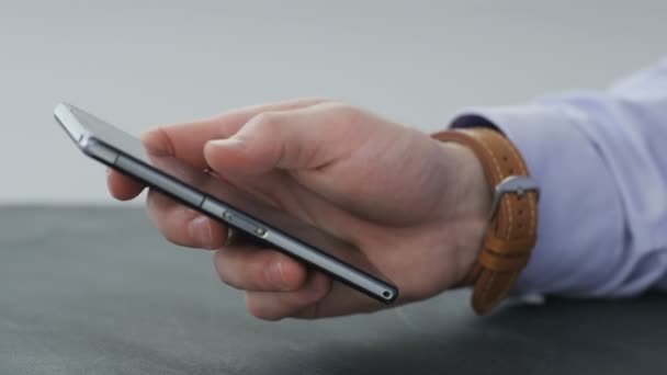 Hands of a businessman using a mobile phone. - Footage, Video