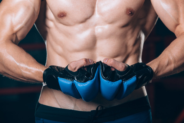 Muscular Fighter kickbox With blue gloves - Fotografie, Obrázek
