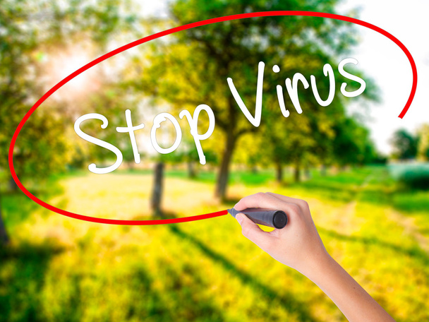 Woman Hand Writing Stop Virus with a marker over transparent boa - Photo, Image
