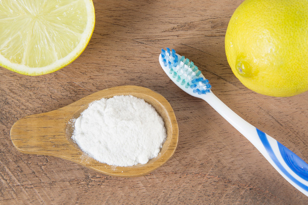 Top view of baking soda with toothbrush and lemon - Zdjęcie, obraz