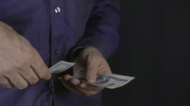 Businessman throws money into camera - Video