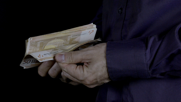 Man counts money in hands - Кадры, видео