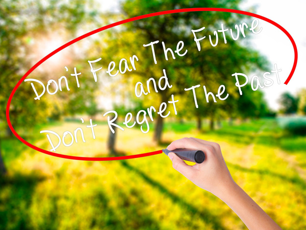 Woman Hand Writing Don't Fear The Future and Don't Regret The Pa - Photo, Image