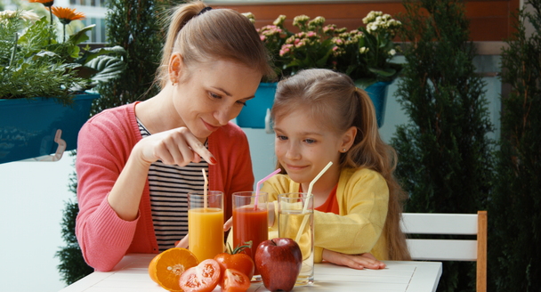 Family promoting healthy juice and looking at camera. Thumbs up. Ok - Footage, Video