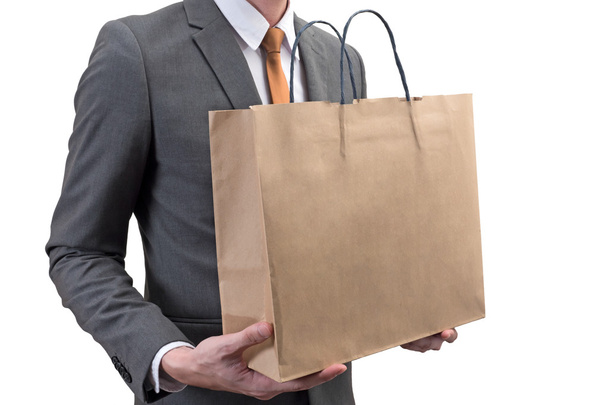 Бізнесмен тримає торгову сумку ізольовано на білому тлі
 - Фото, зображення