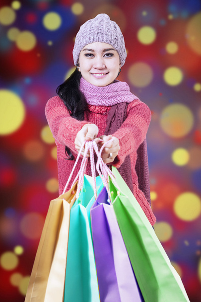 Shopaholic holds shopping bags - Foto, imagen