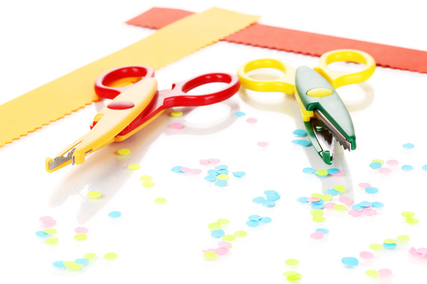 Colorful zigzag scissors with paper strips isolated on white - Valokuva, kuva