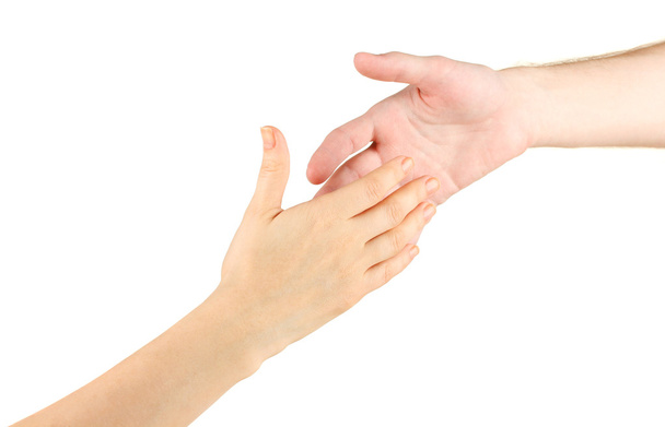 Women's hand goes to the man's hand on white background - Zdjęcie, obraz