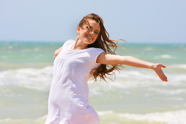 young happy girl on sea background - Photo, Image