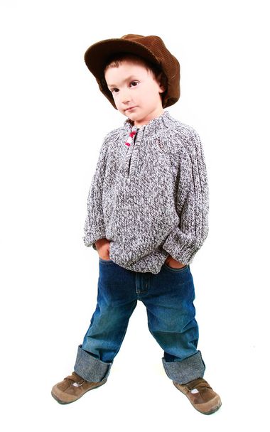 young boy with hands in pockets over white - 写真・画像