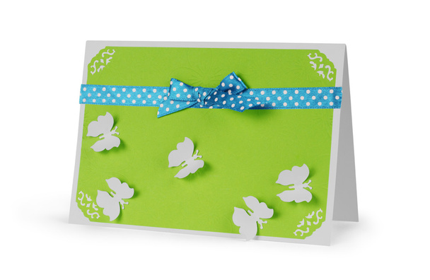 close up of a note card with ribbon bow on white background - Valokuva, kuva