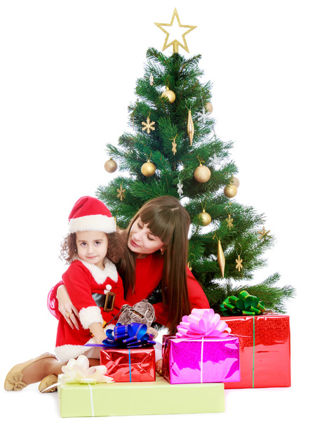 Mother with daughter near the Christmas tree - Zdjęcie, obraz