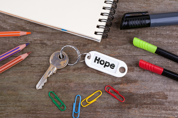 Old key With Hope Text. Wooden texture background with pencils,  - Photo, Image