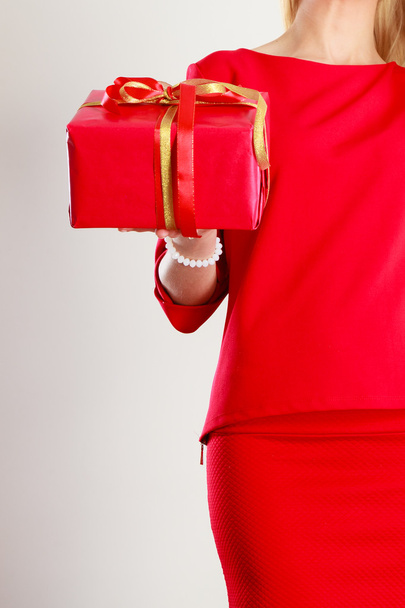 Part body lady with red gift. - Zdjęcie, obraz