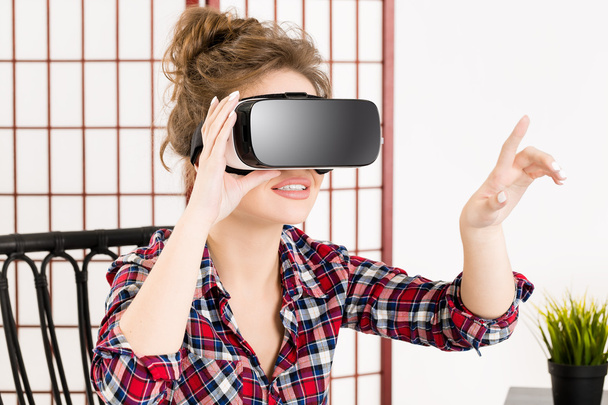 Girl getting experience using VR glasses of virtual reality - Photo, Image