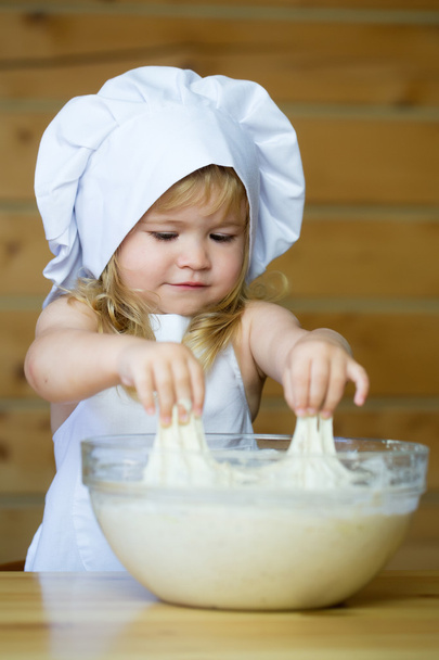 happy boy child cook kneading dough - Valokuva, kuva