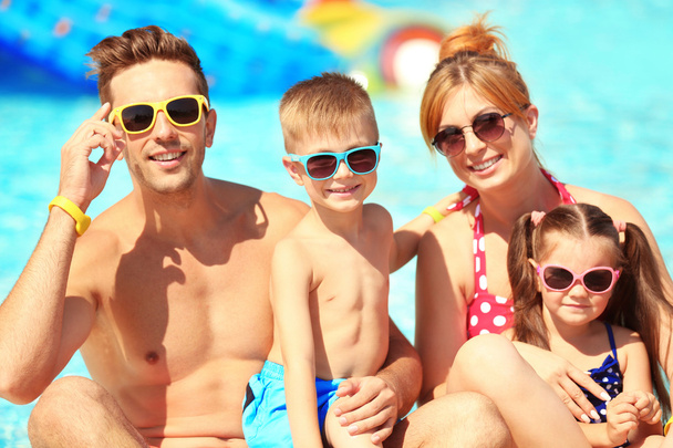 Family at swimming pool - Фото, изображение