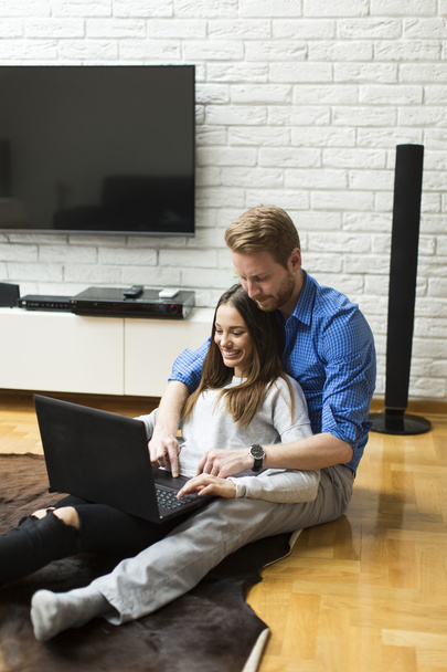 Couple with a laptop at home - Photo, Image