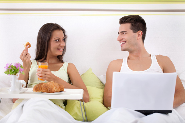 couple sitting on bed in morning - Photo, Image