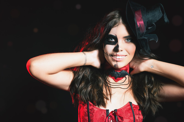 Beautiful hairstyle and scary makeup at Halloween party - Foto, Imagen