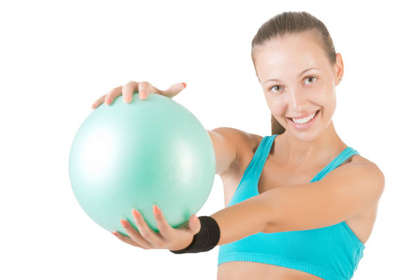 Fit Woman Standing Holding a Pilates Ball - Photo, Image