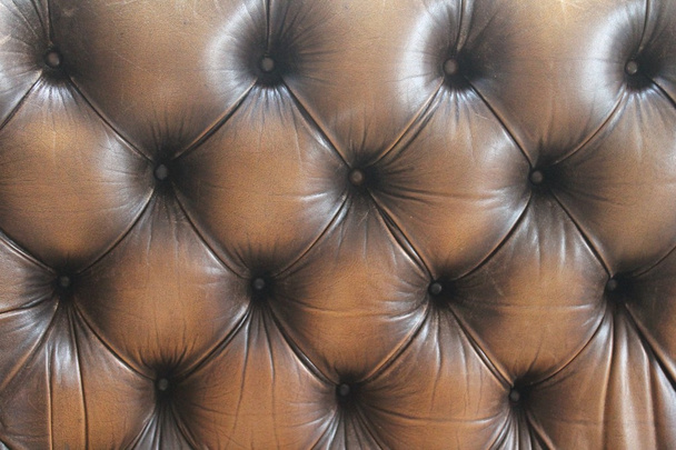 sofá de cuero botón fondo marrón oscuro - Foto, imagen
