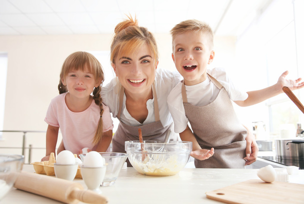 Mother and kids making dough - Photo, image