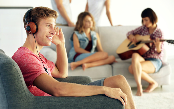 Handsome man listening to music at home - Photo, image