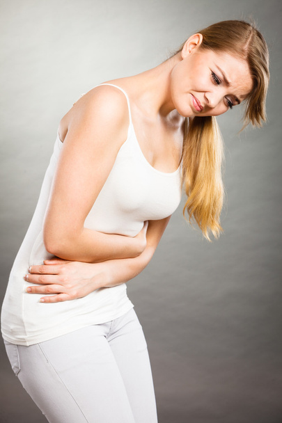 Woman suffer from belly pain. - Zdjęcie, obraz