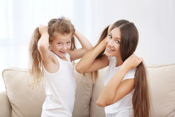 Cute girl with mother - Foto, Imagen