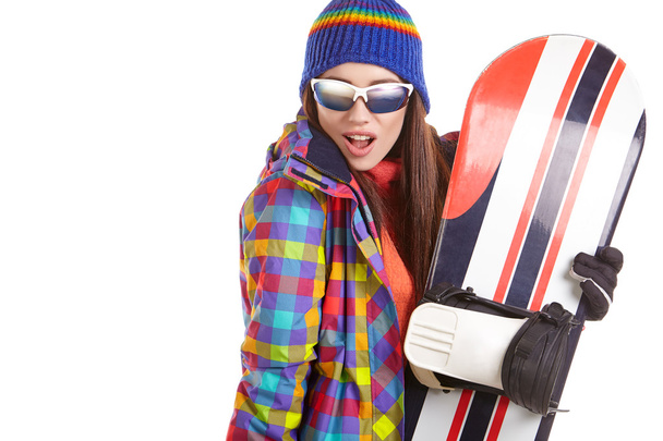 Young woman standing with snowboard   - Foto, Imagen