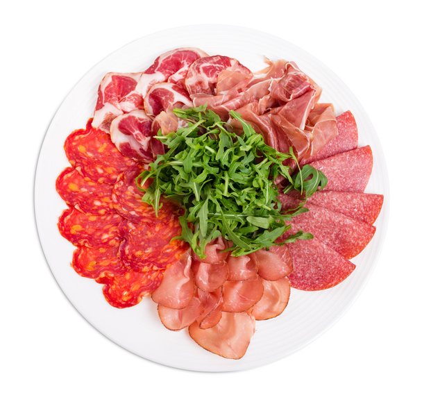 Delicious meat platter with arugula. - Foto, imagen