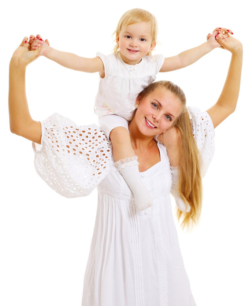 Young mother with daughter on her shoulders - Фото, изображение
