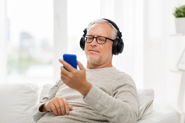 happy senior man with smartphone and headphones - Fotoğraf, Görsel