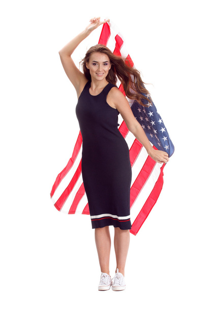 Happy young woman holding USA flag. Image isolated - Foto, Imagen