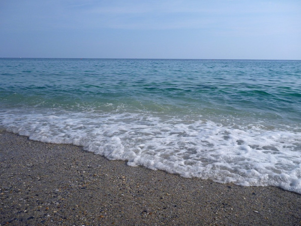 Spiaggia di sabbia con piccole pietre
 - Foto, immagini