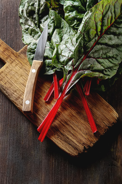 Swiss rainbow chard, vibrant vegetable. Flat lay, knife from abo - Photo, image