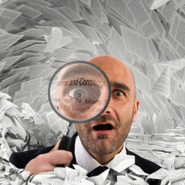 Businessman with a magnifying glass  - Photo, Image