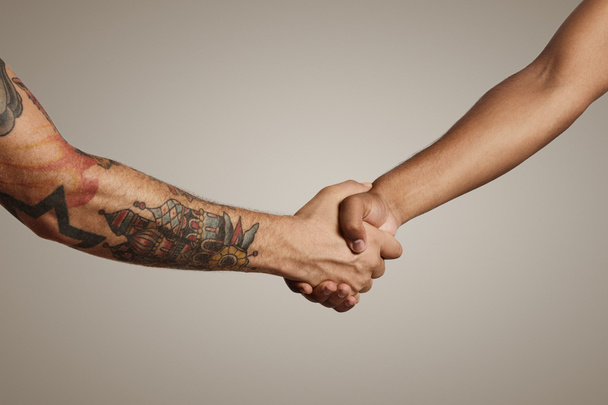 Handshake of two muscular men's hands - Fotó, kép