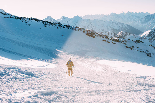 climber man in snowy caucasus mountains - Zdjęcie, obraz