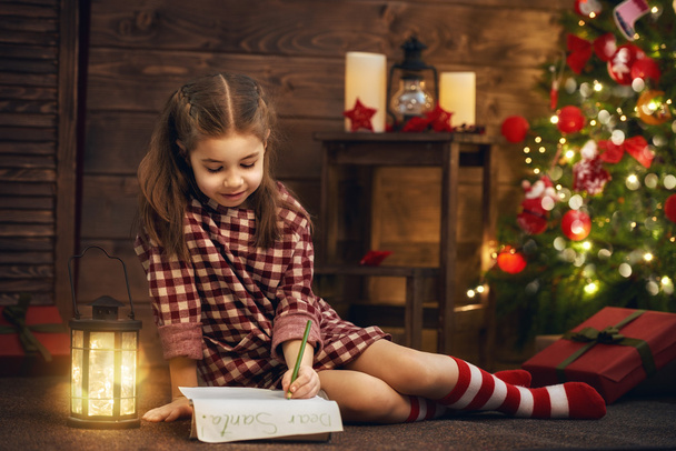 girl writes the letter to Santa - Photo, image