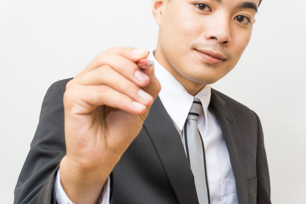 Mão de negócios asiático homem escrever no fundo branco seletivo foco
 - Foto, Imagem