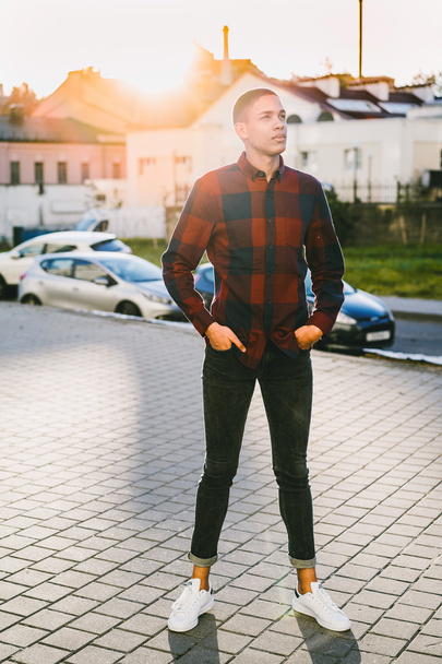 man standing on modern city background - 写真・画像