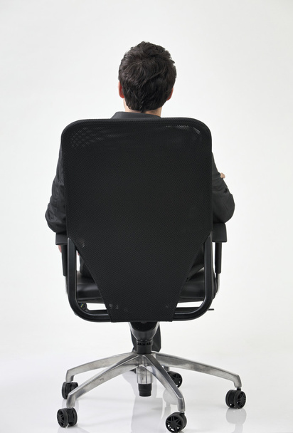 Back view of man on chair - 写真・画像